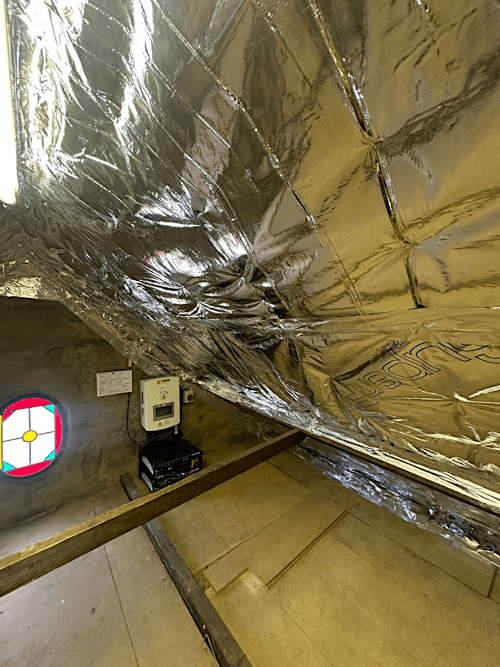 Wall insulation installation being completed